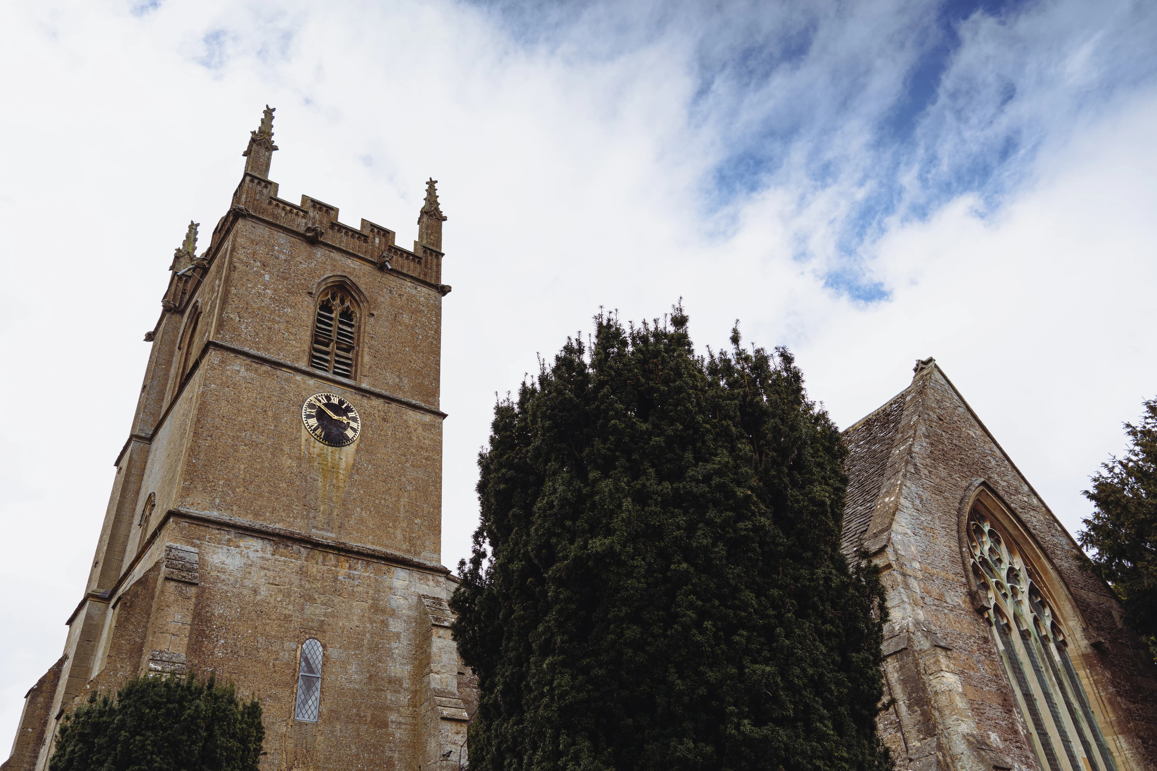 a tall tower with a clock on the side of it