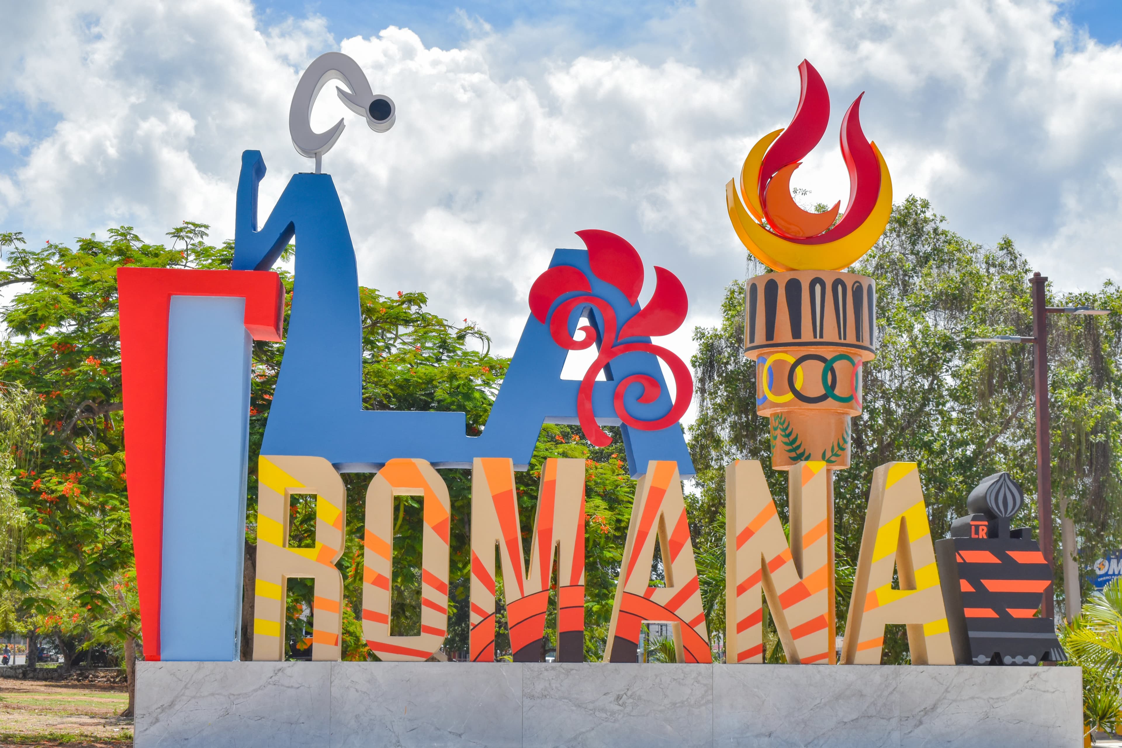 a large sign with a tower in the background