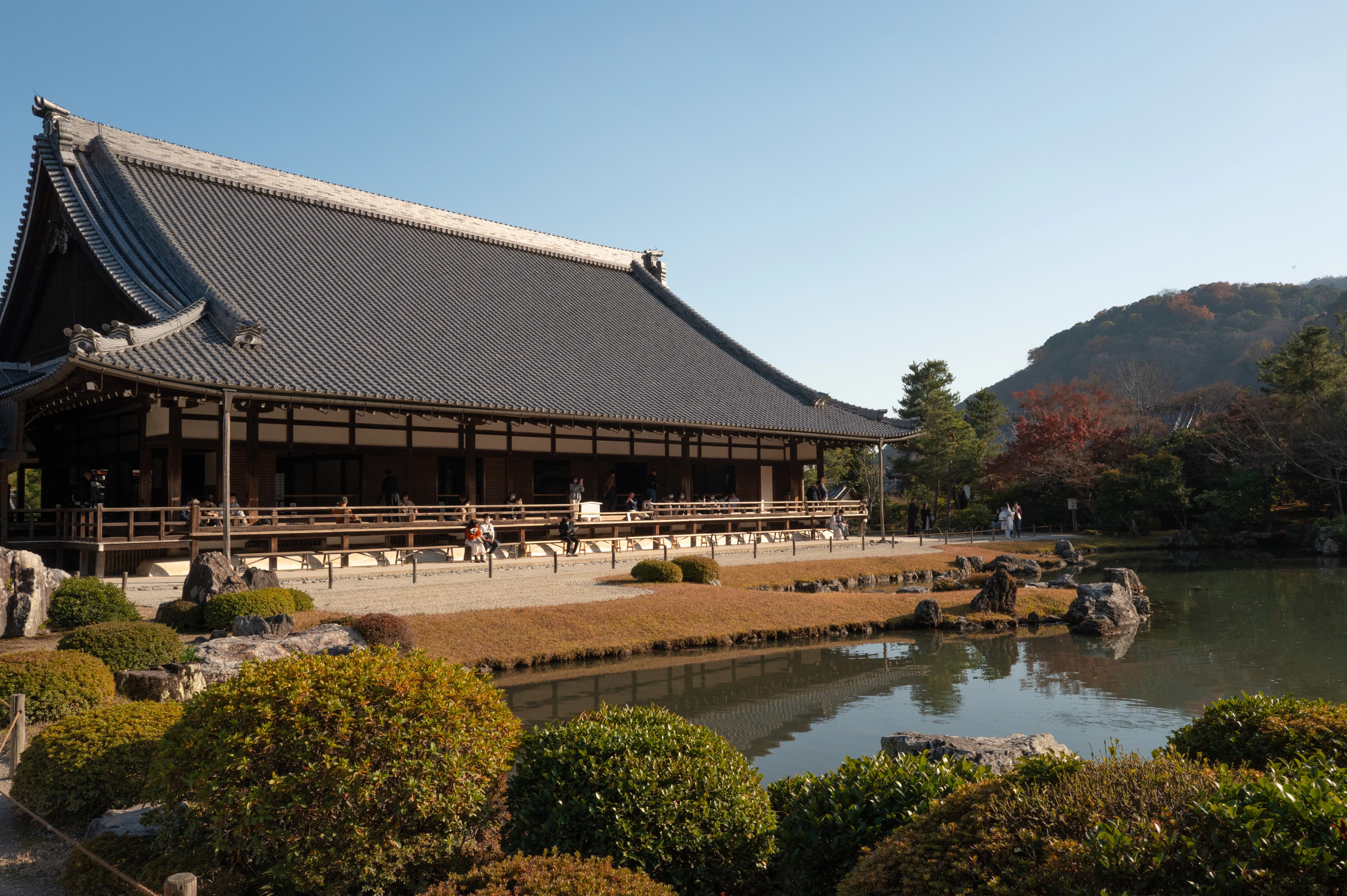a building with a pond in front of it