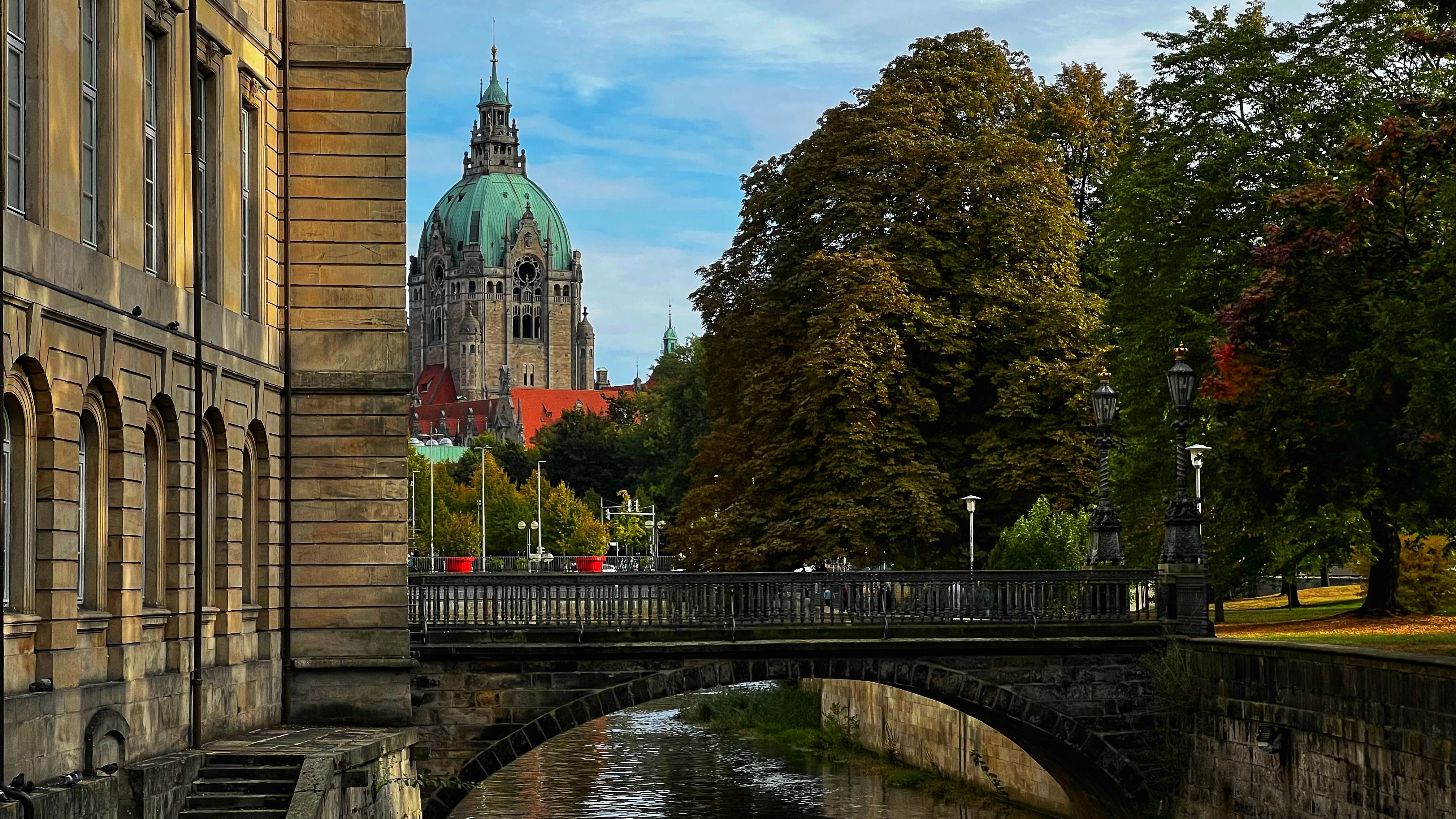 Historic building with dome overlooking canal and bridge