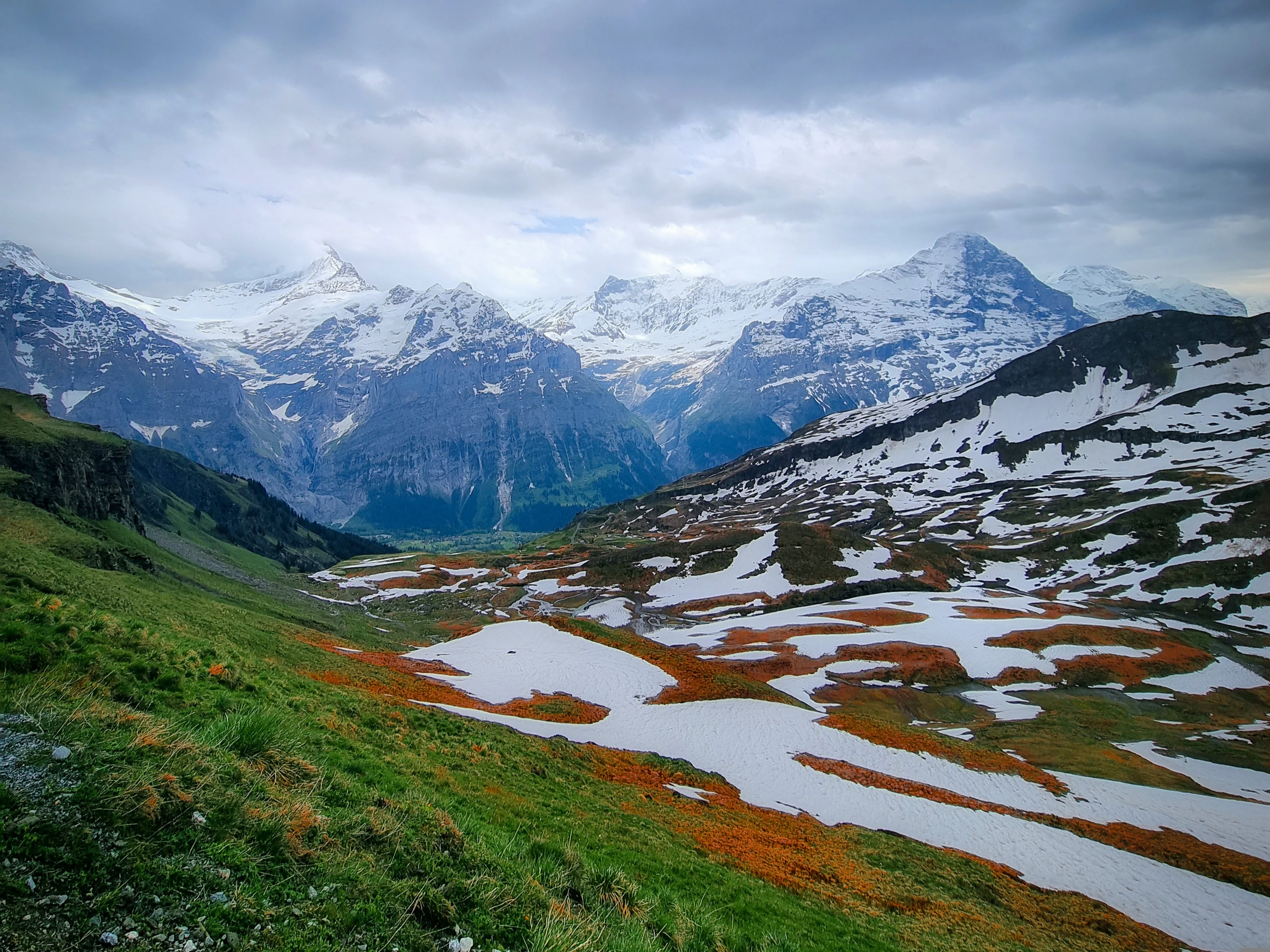 A view of a mountain range with snow on the mountains