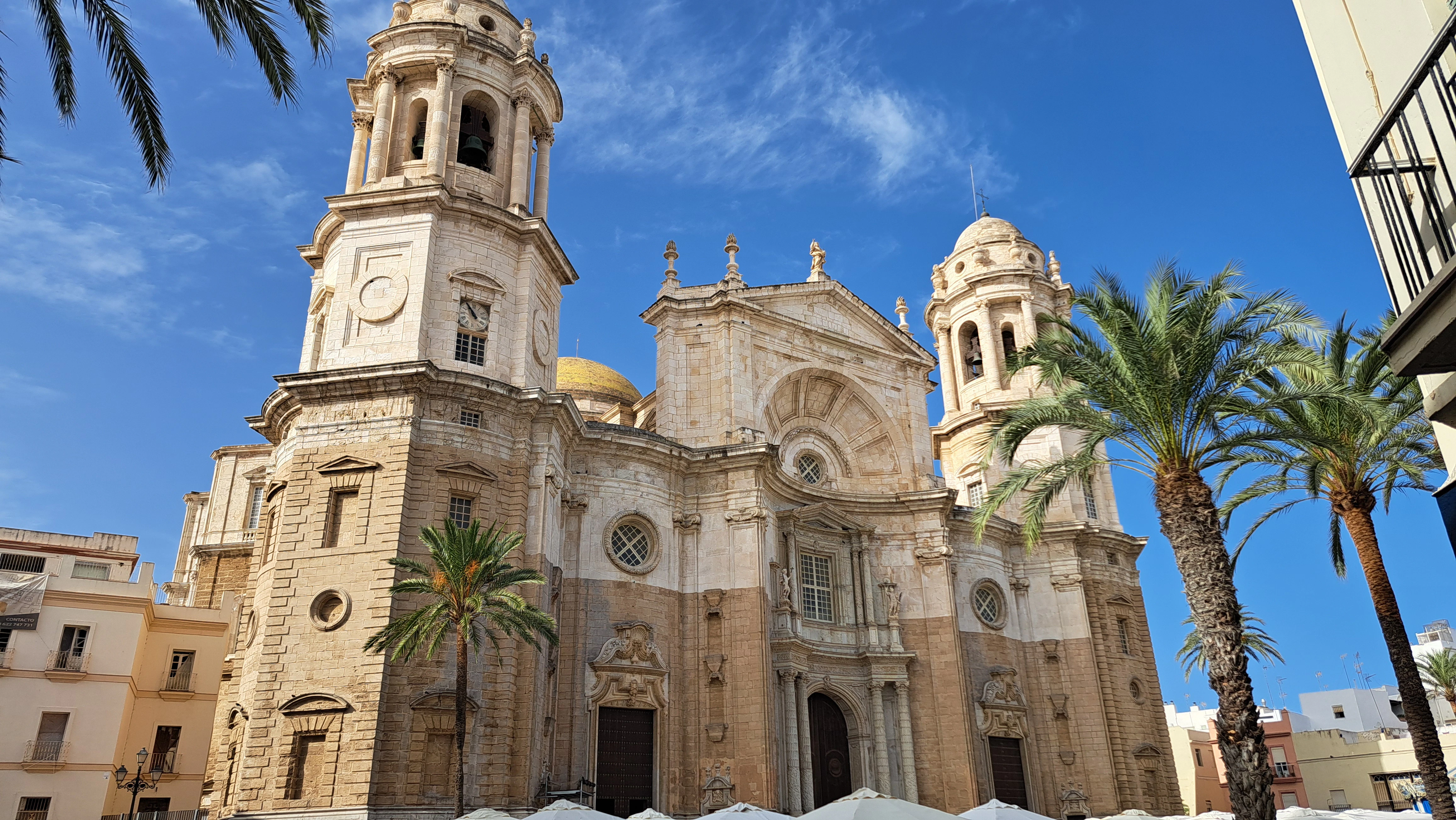 A large cathedral with a clock on the front of it