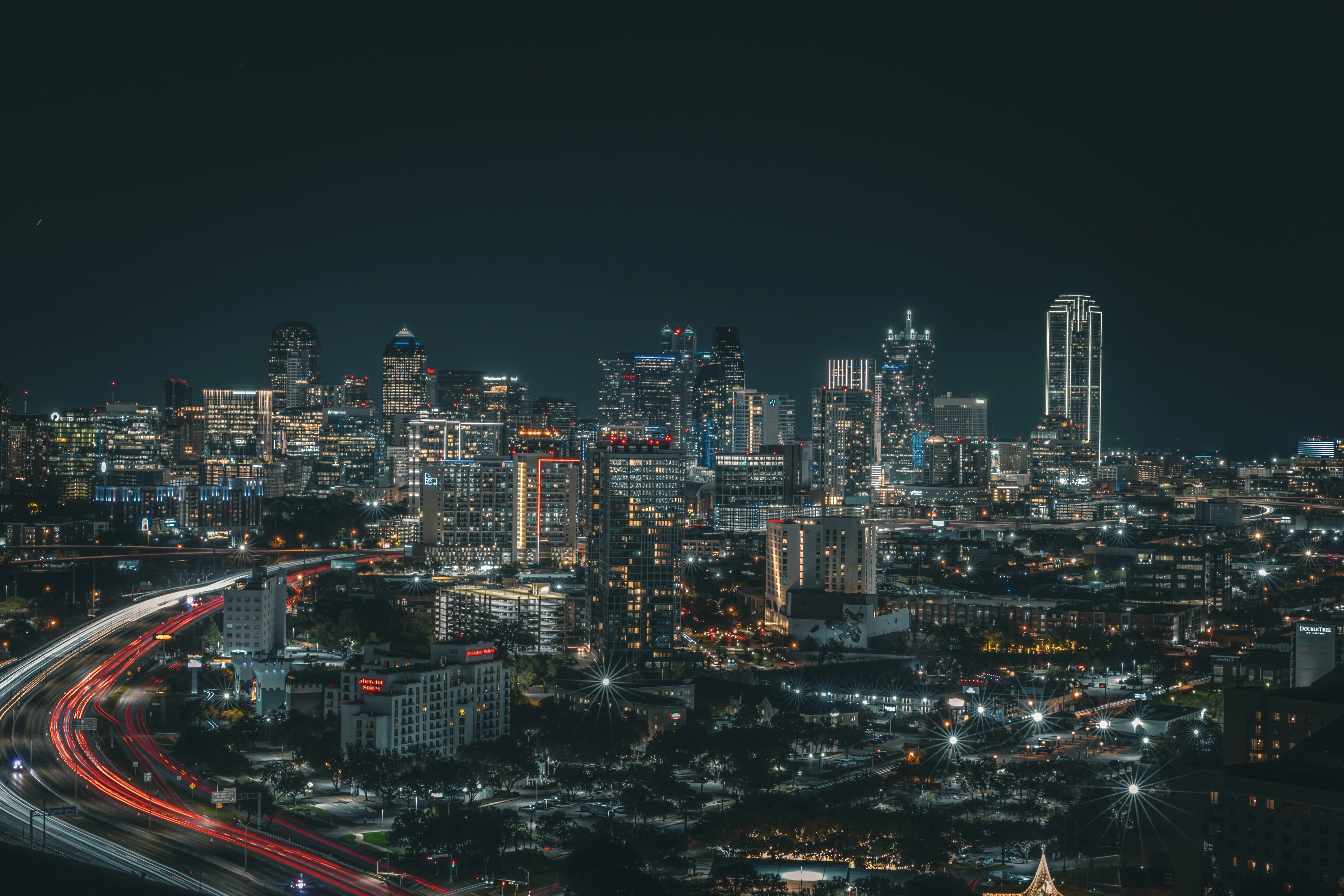 Vibrant cityscape with light trails at night