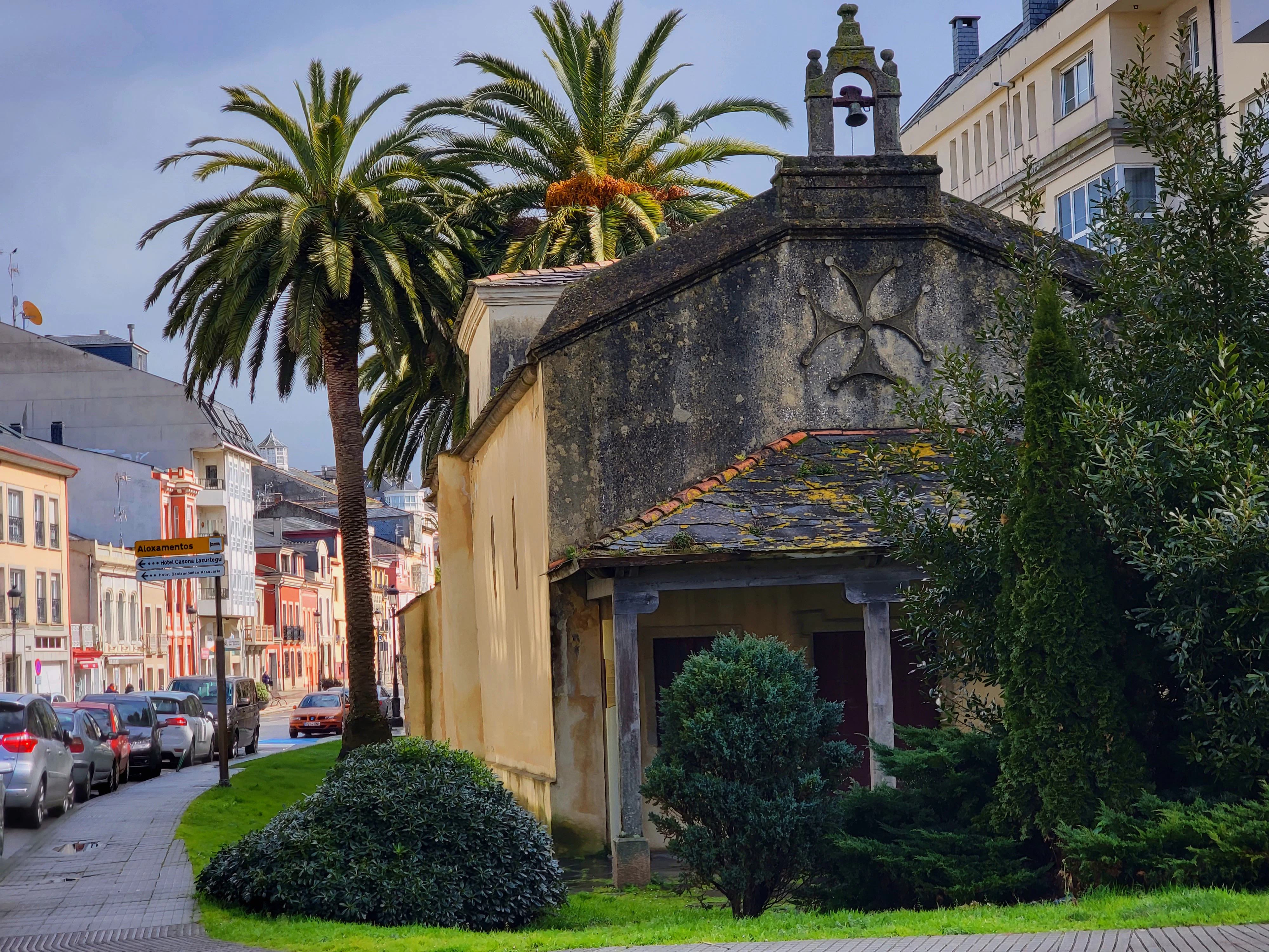a small building with a clock on the top of it