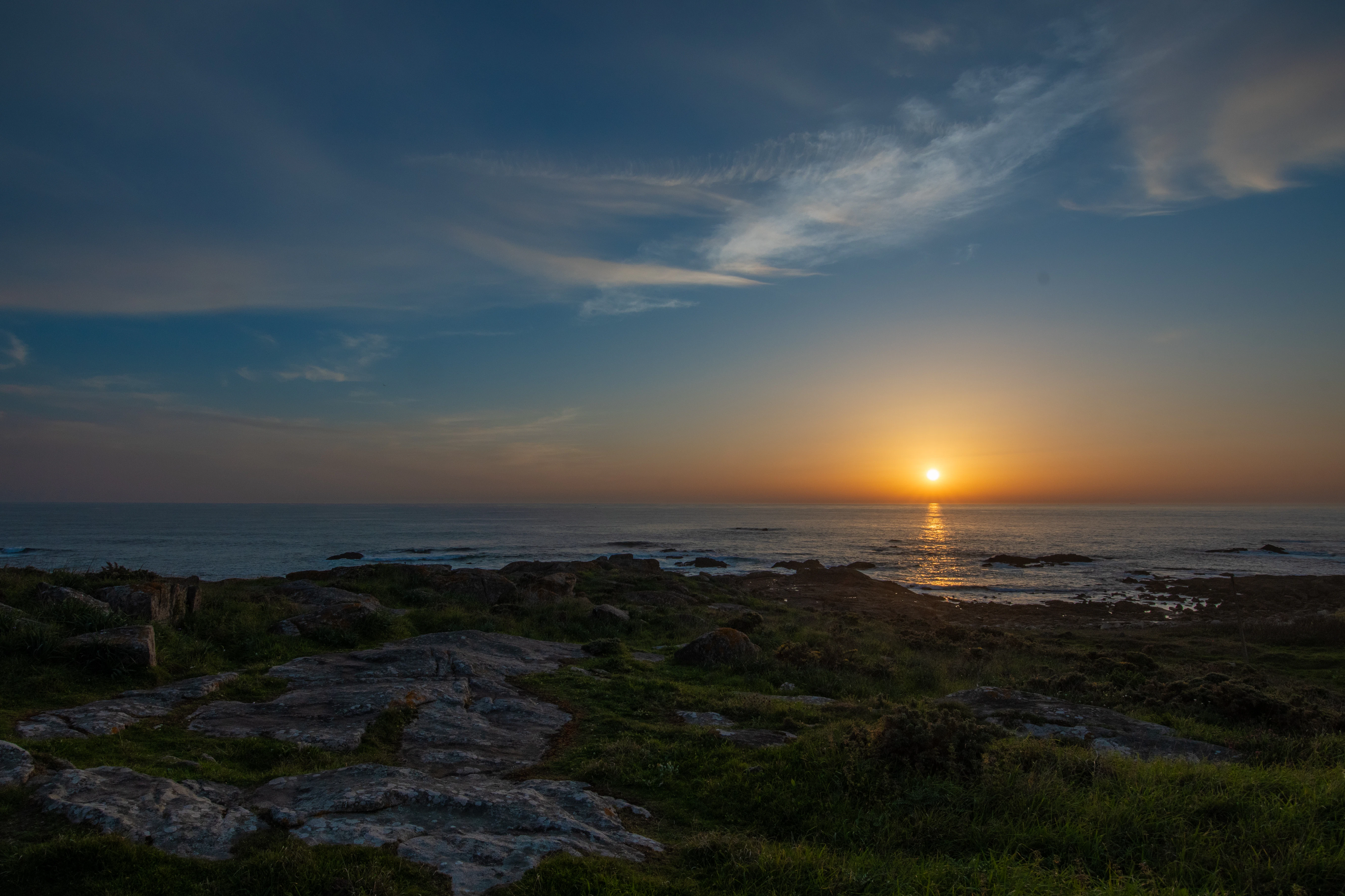 Sunset over the ocean, beautifully tranquil and serene.
