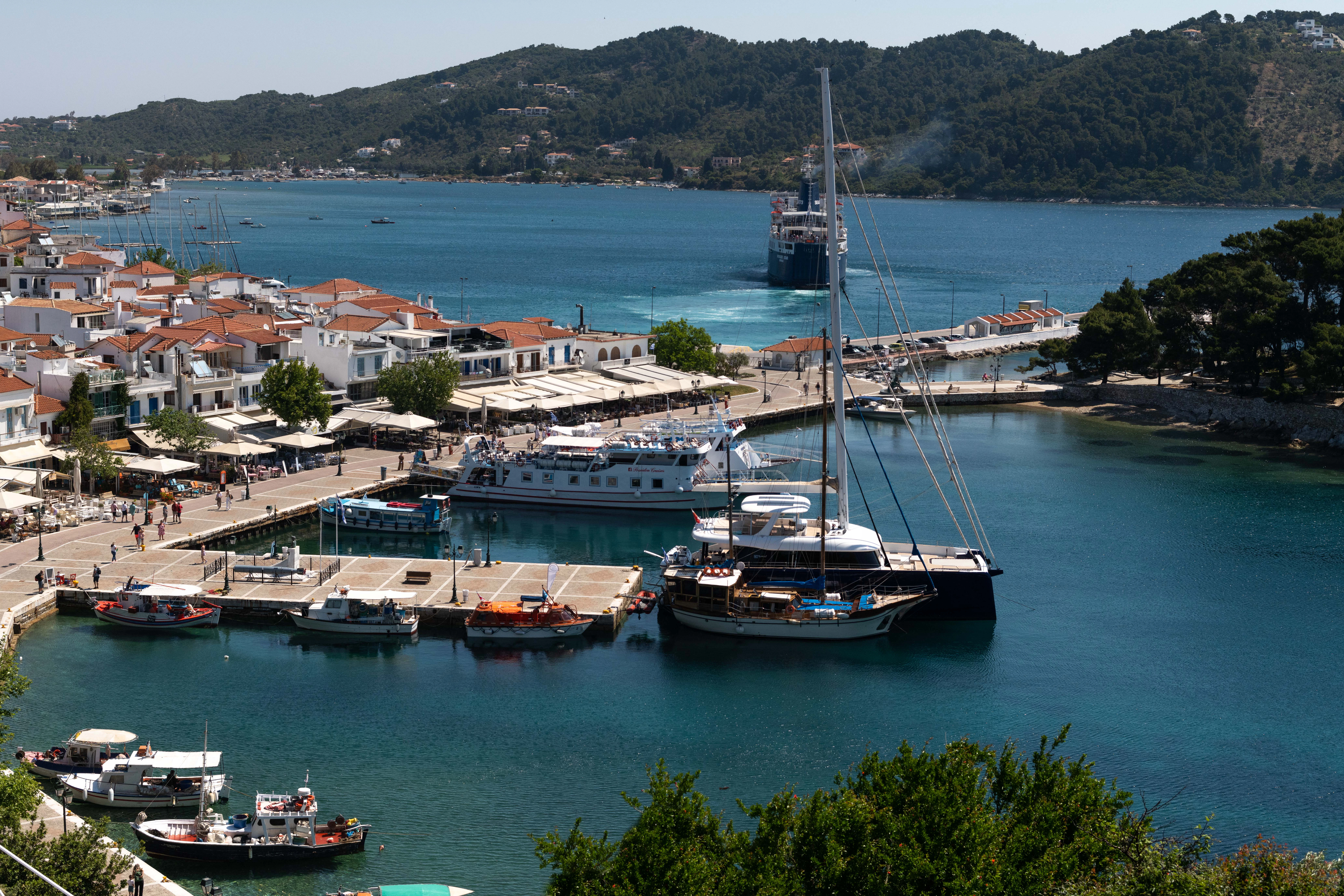 a group of boats docked at a port