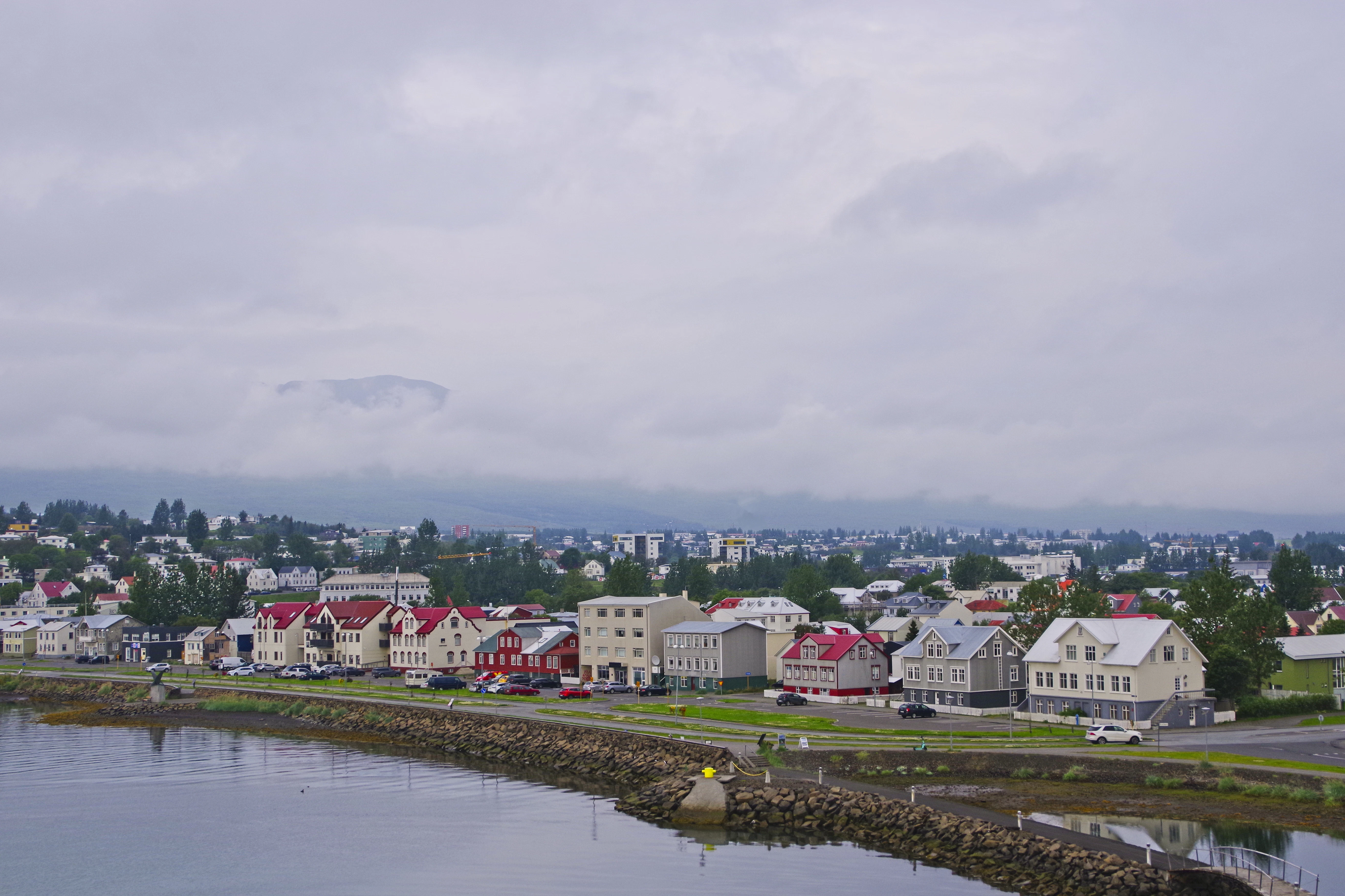 Coastal town with colorful buildings and cloudy sky