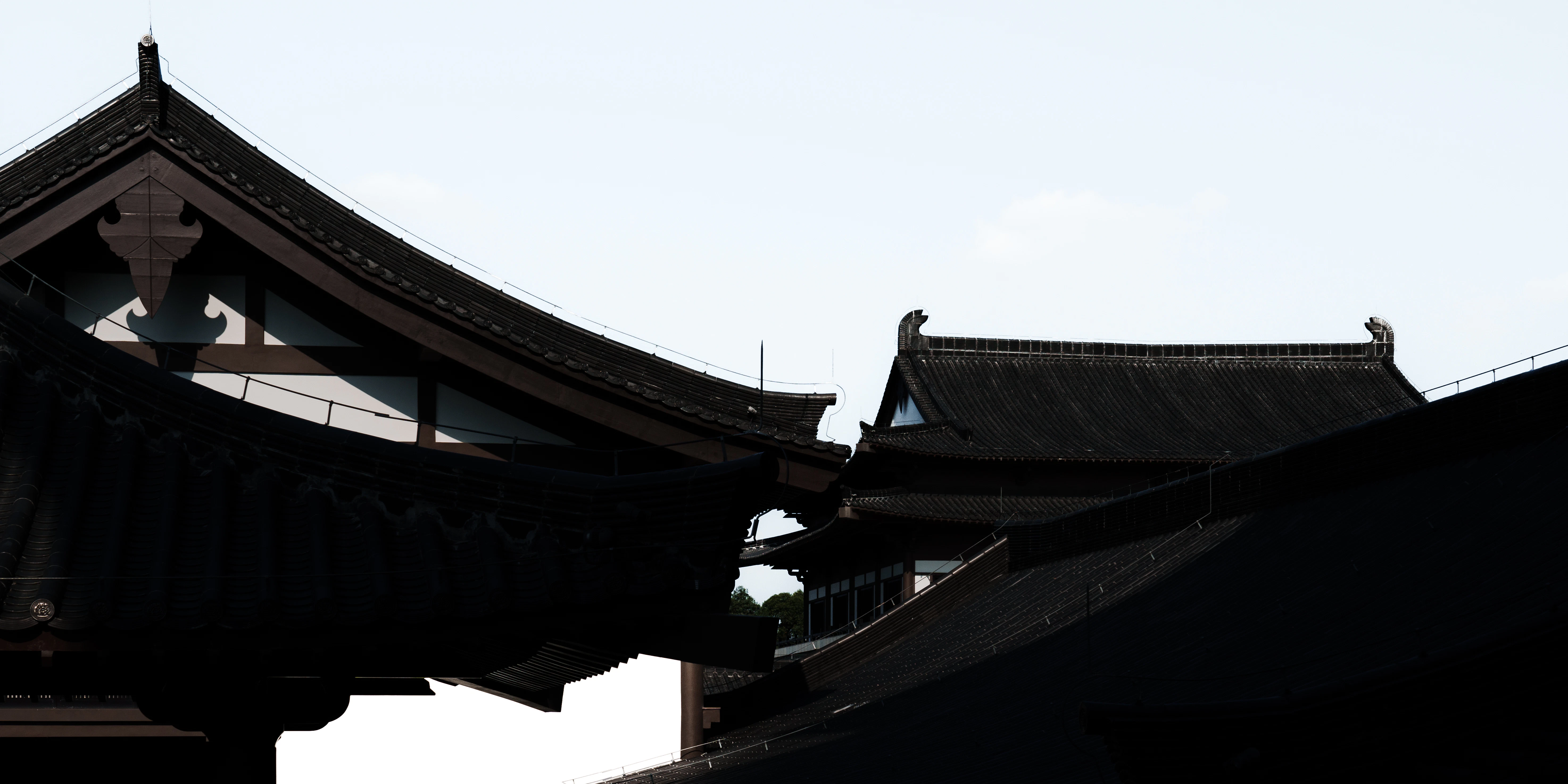 a black and white photo of a building with a clock tower