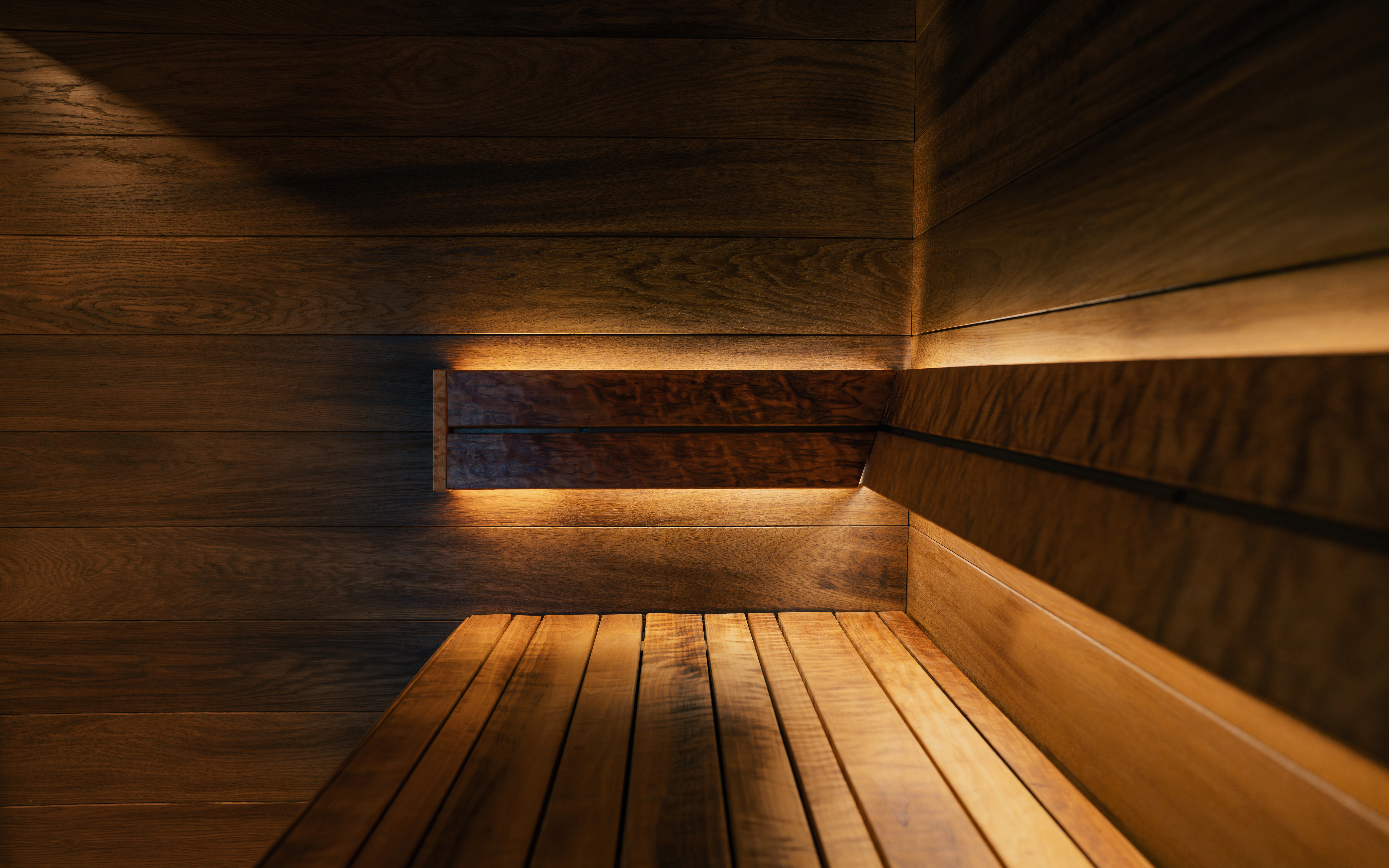 Cozy wooden sauna with warm ambient lighting