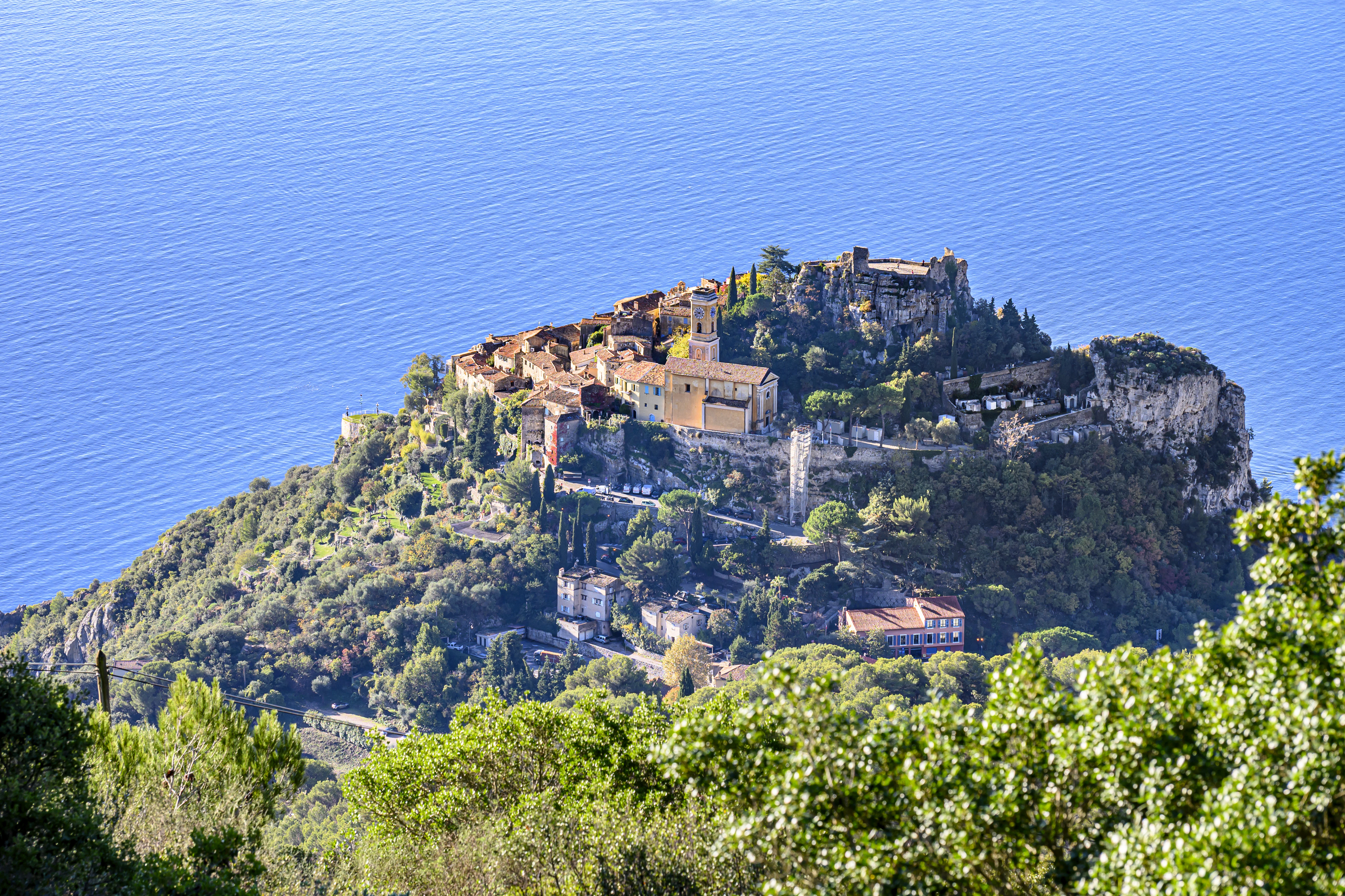 Hilltop village overlooking the blue ocean