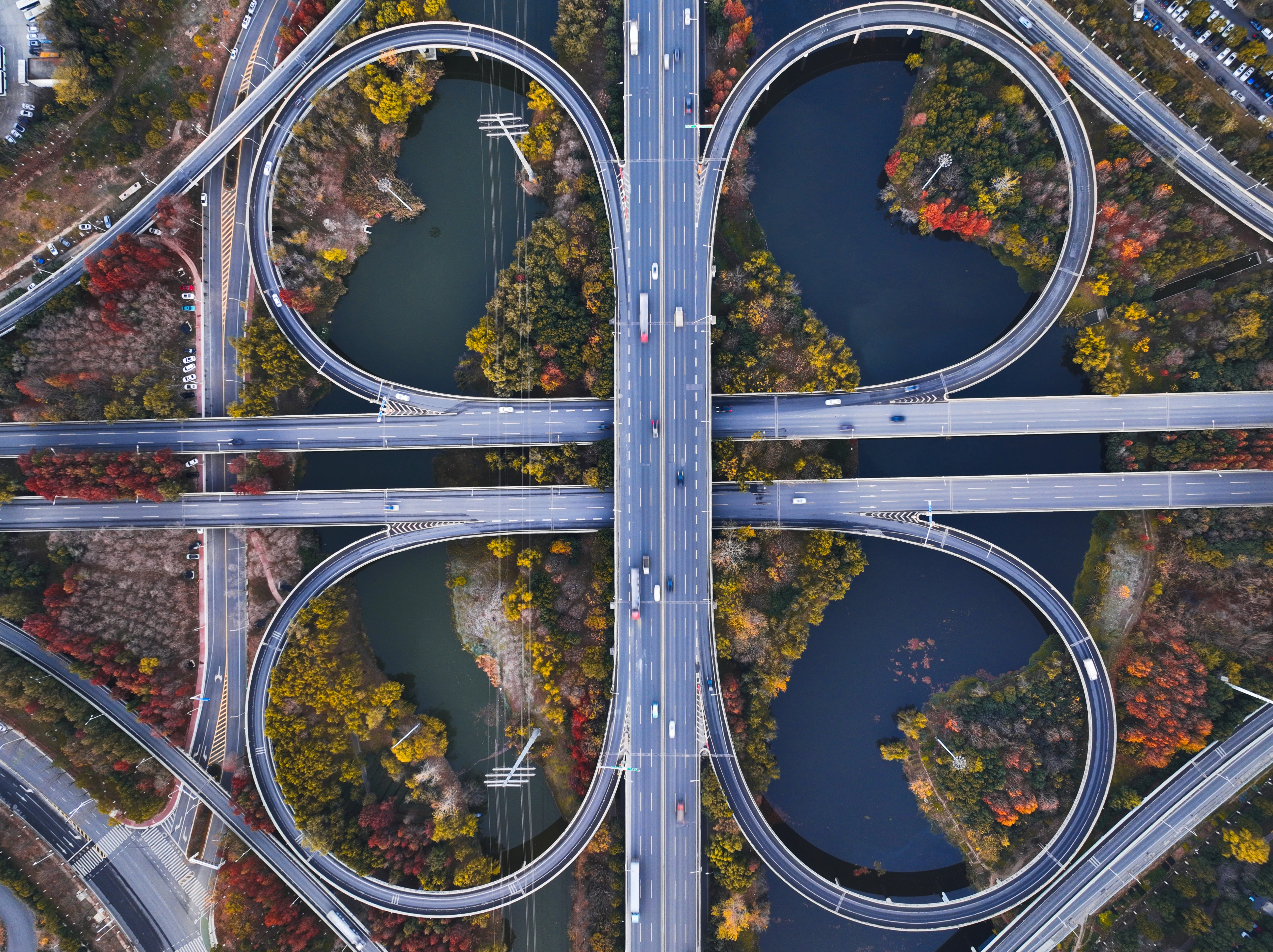Aerial view of a complex highway interchange with cars.