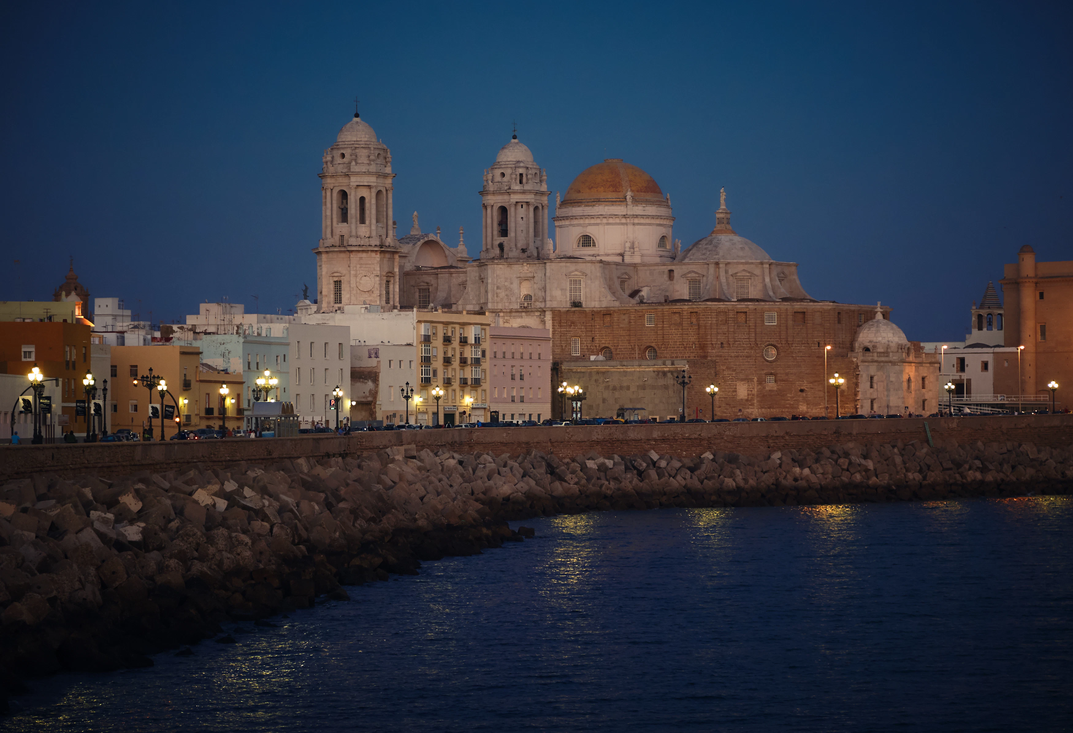 white and brown mosque near body of water