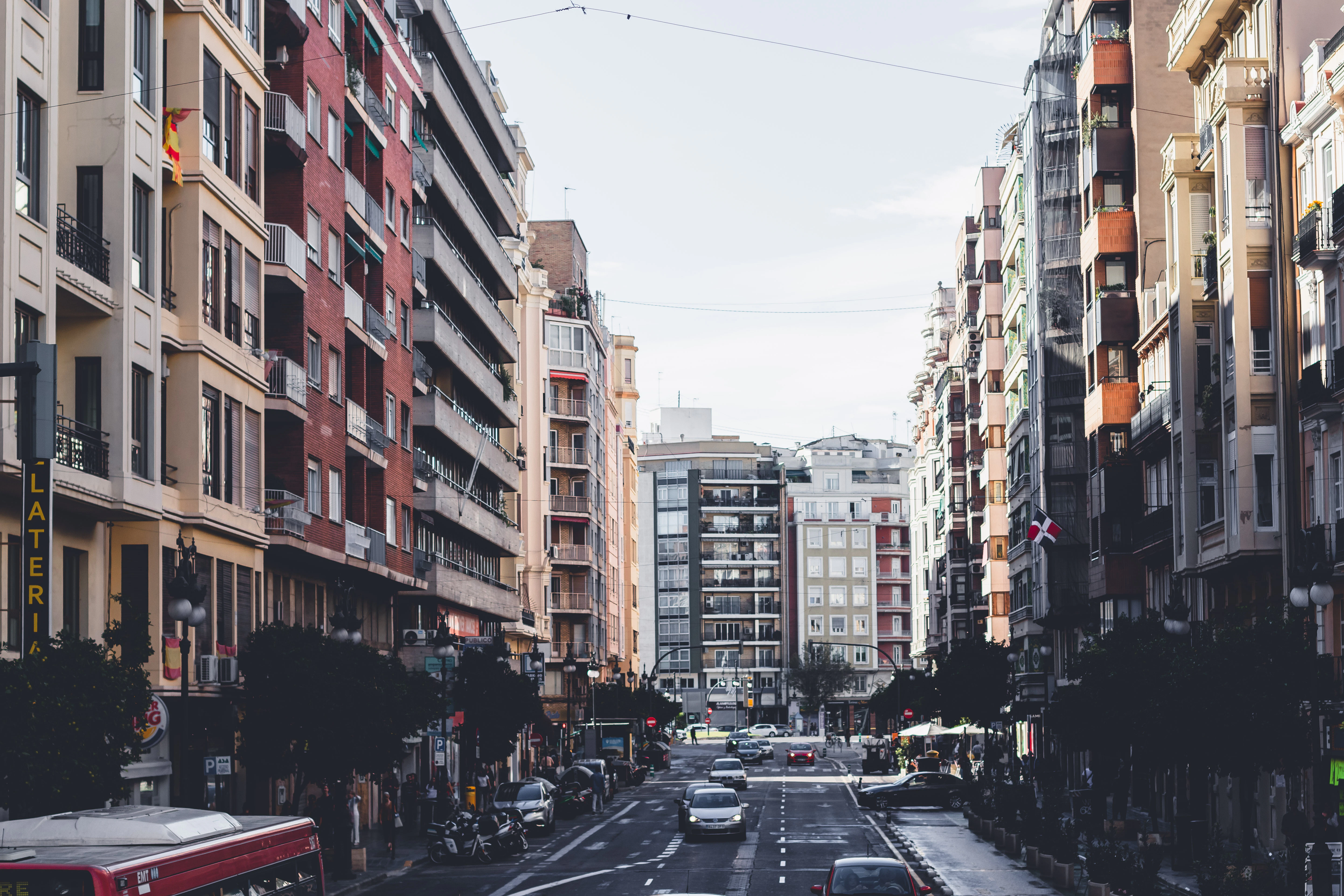 A city street filled with lots of tall buildings
