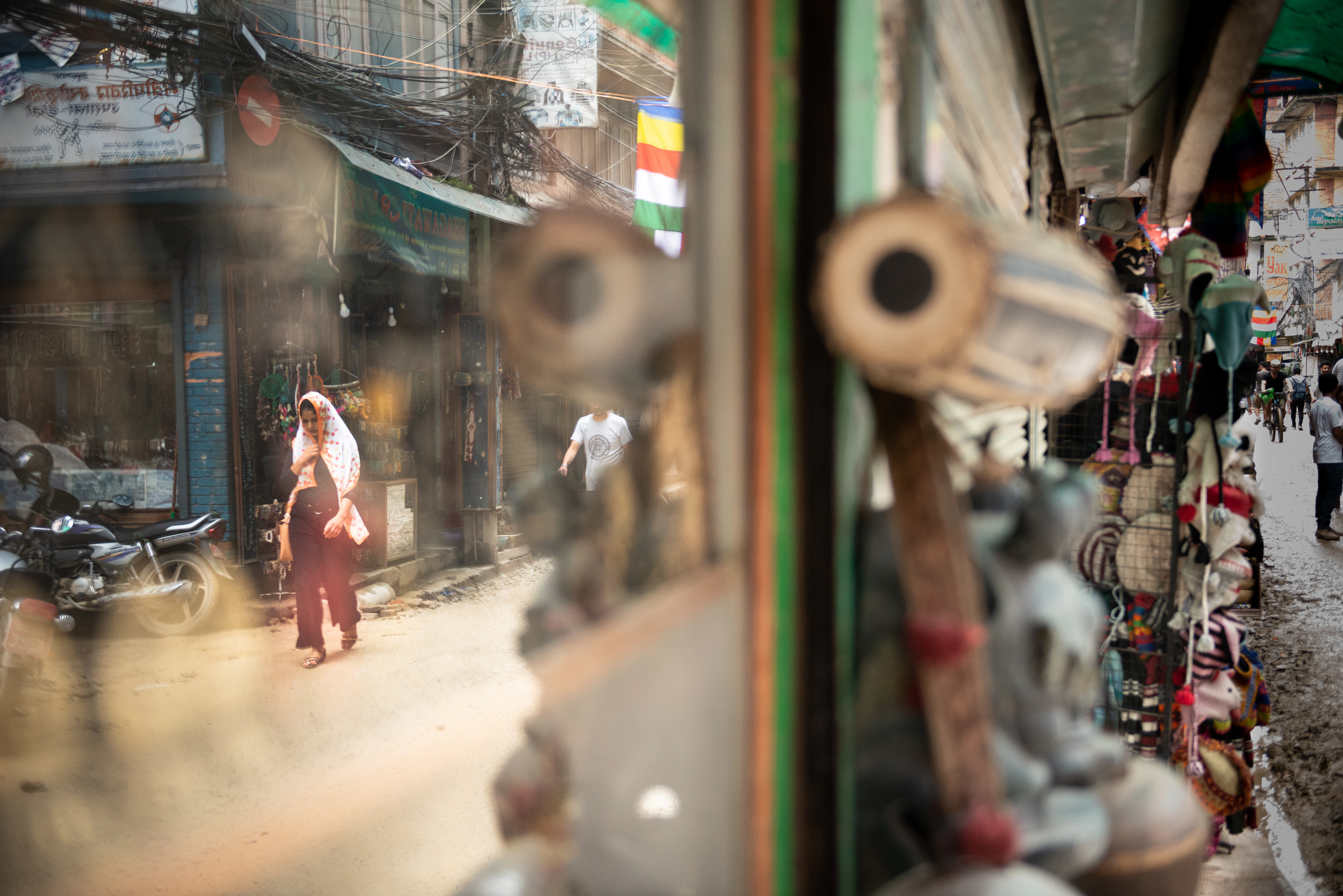 woman in red dress walking on street