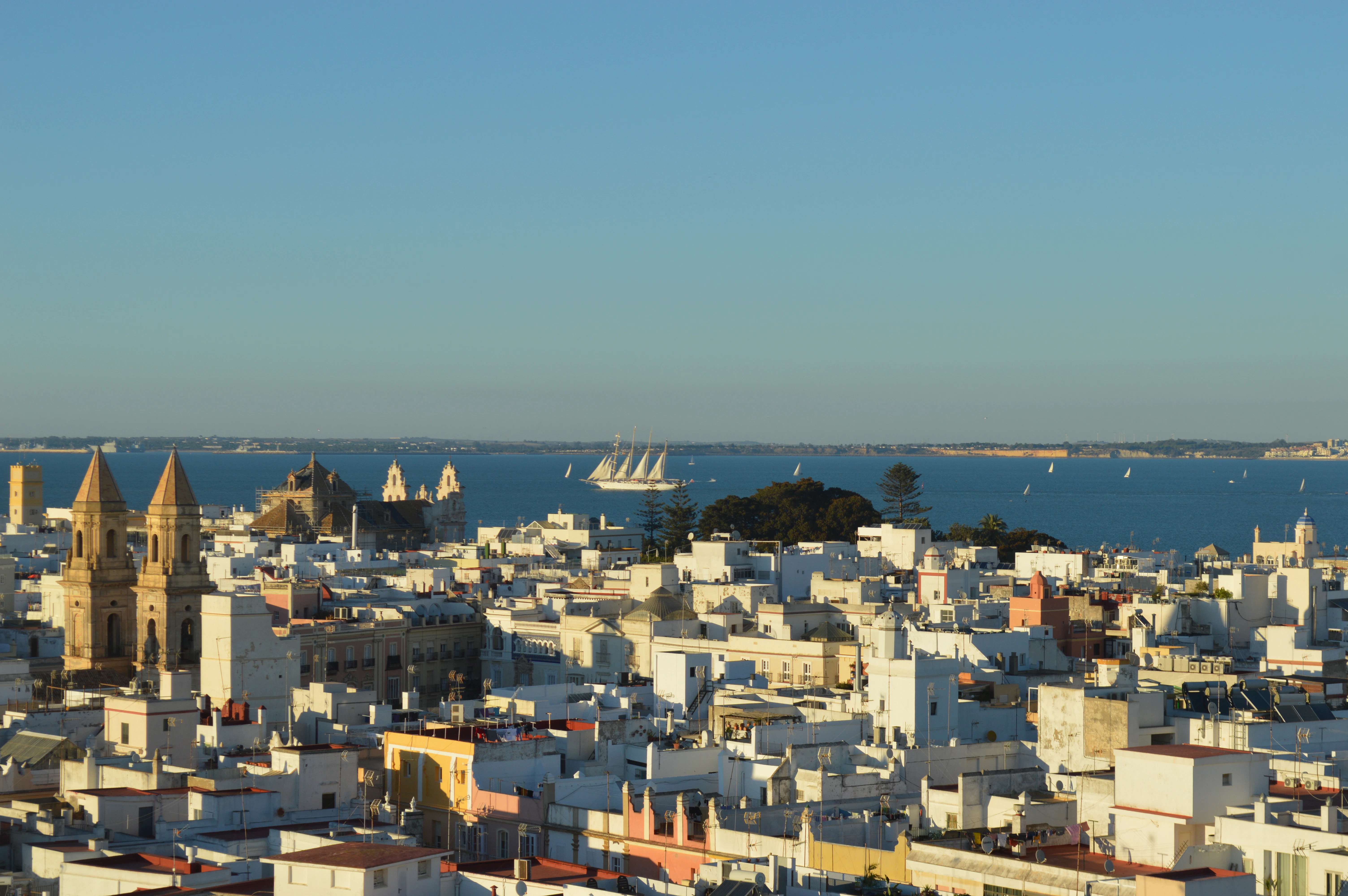 a view of a city with a large body of water in the background