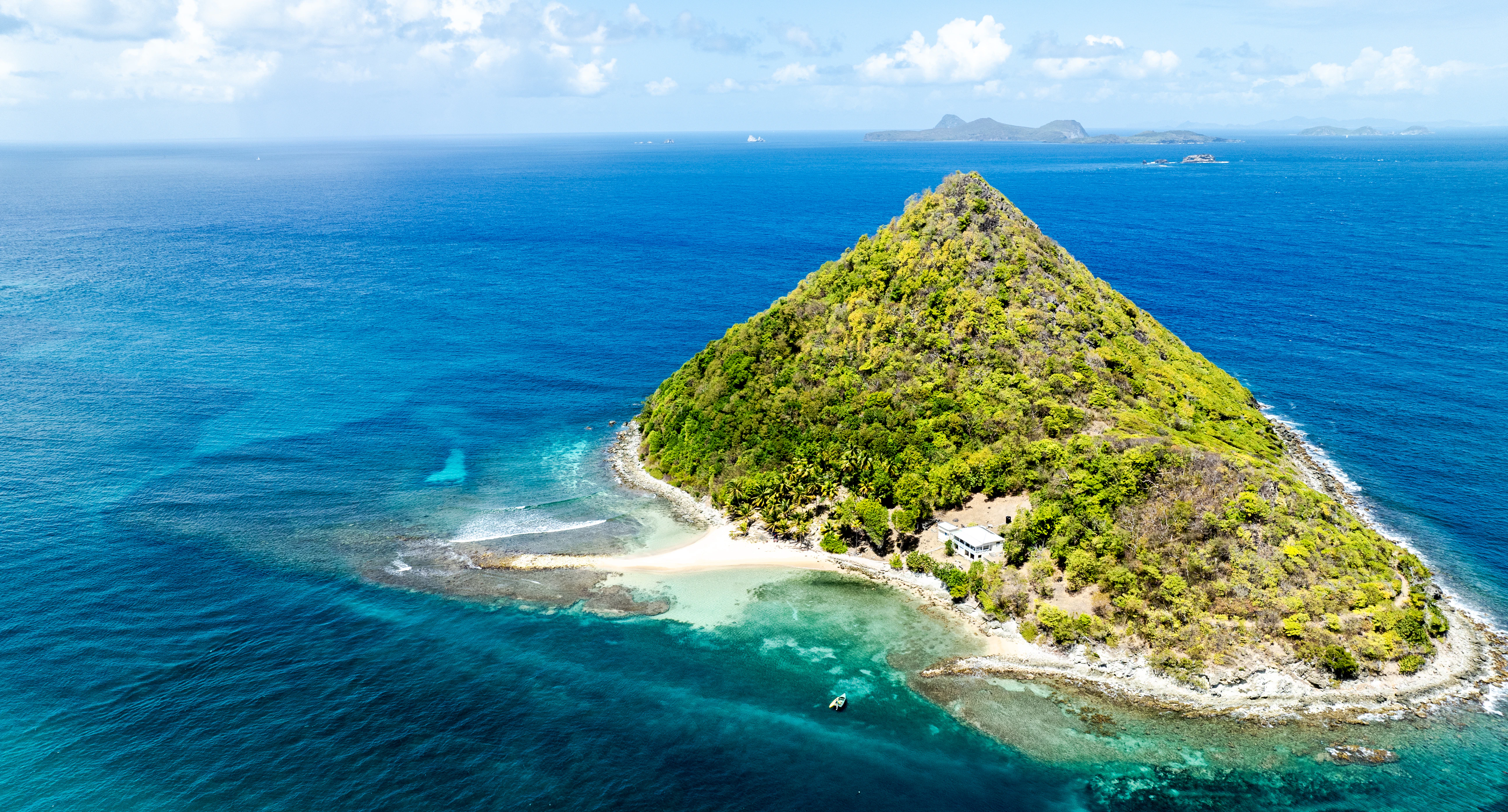 A beautiful, lush green island amidst blue waters.