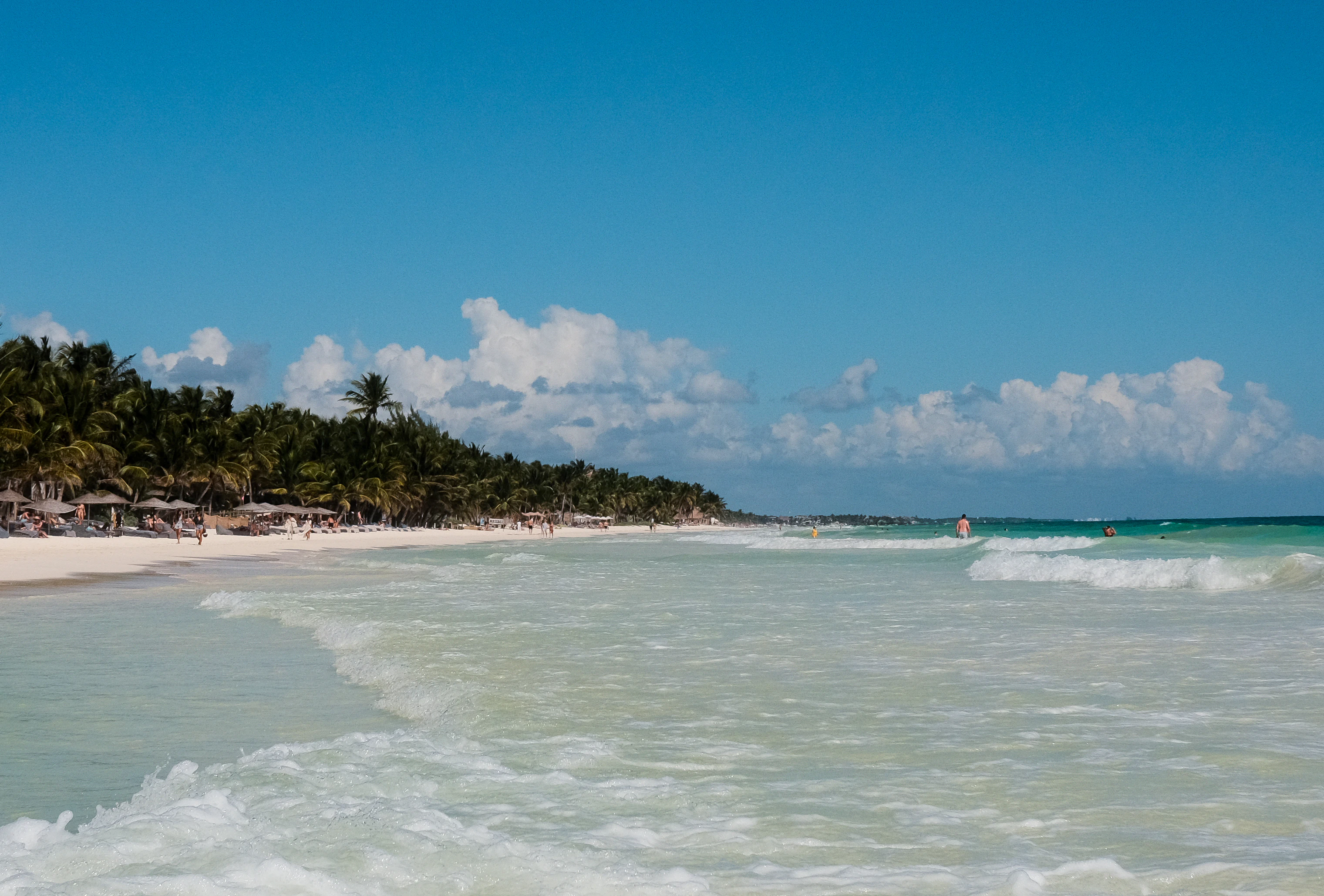a beach that has a bunch of waves in it