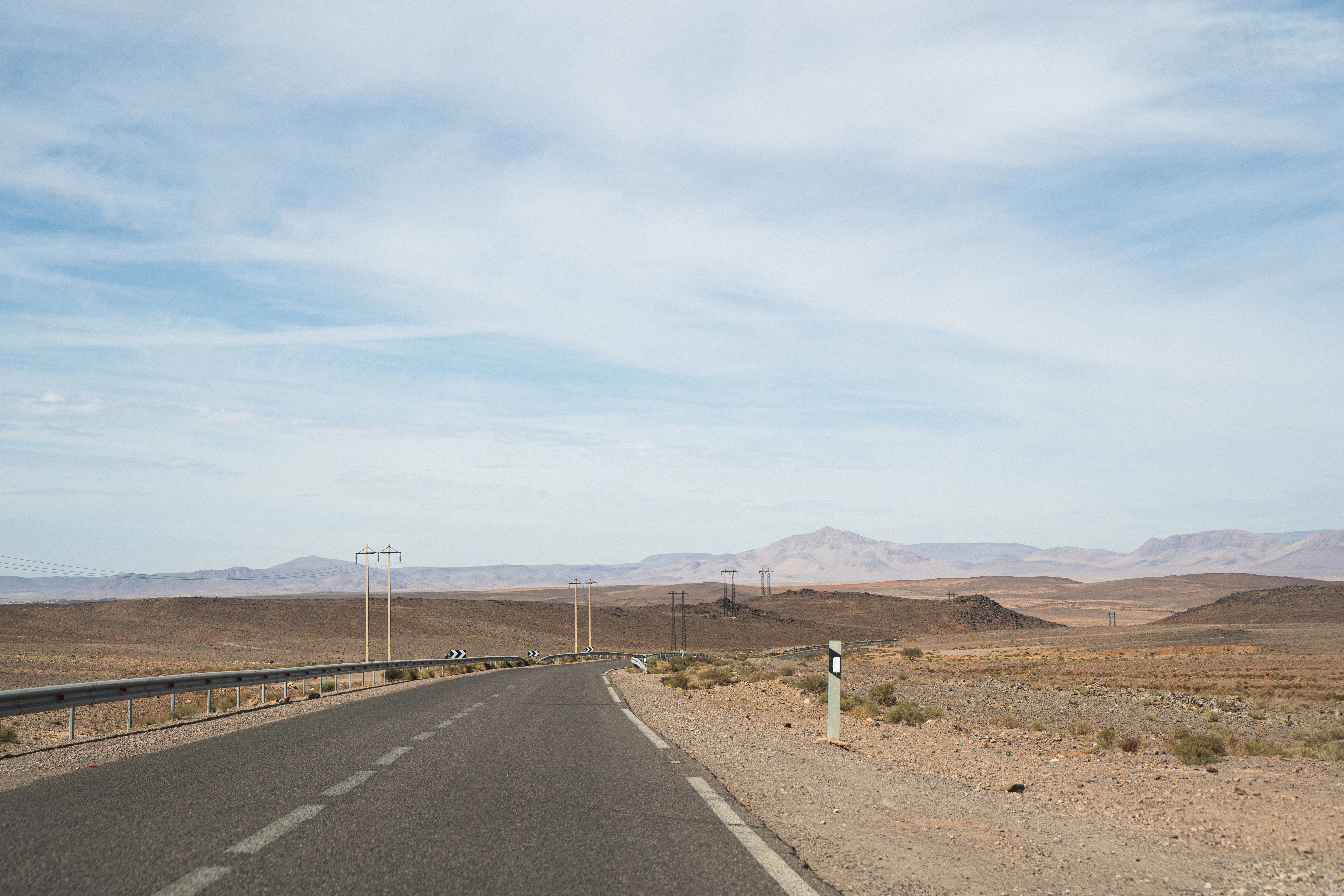 A road through a dry, desert landscape