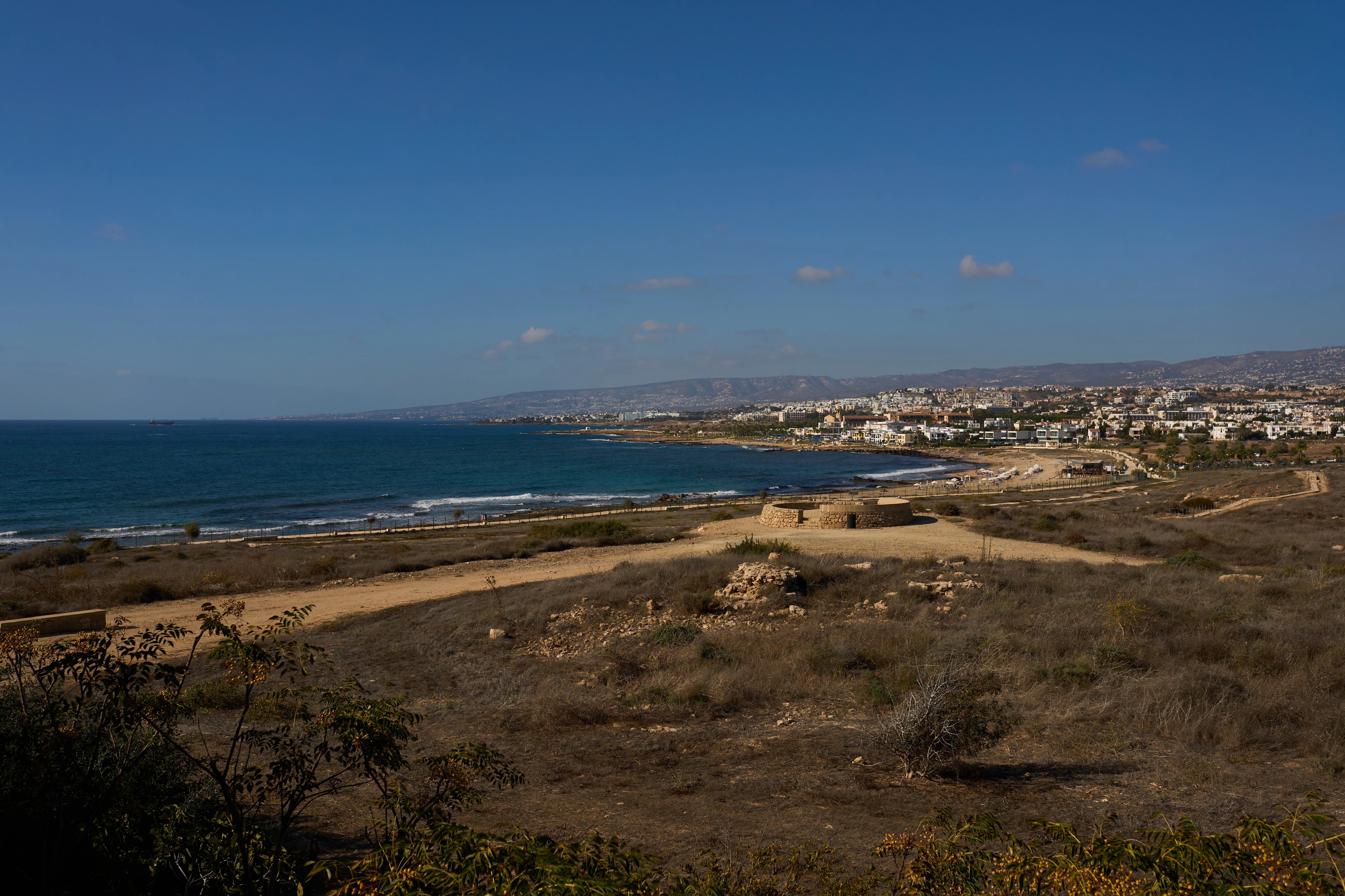 Coastal town with ancient ruins and blue sea