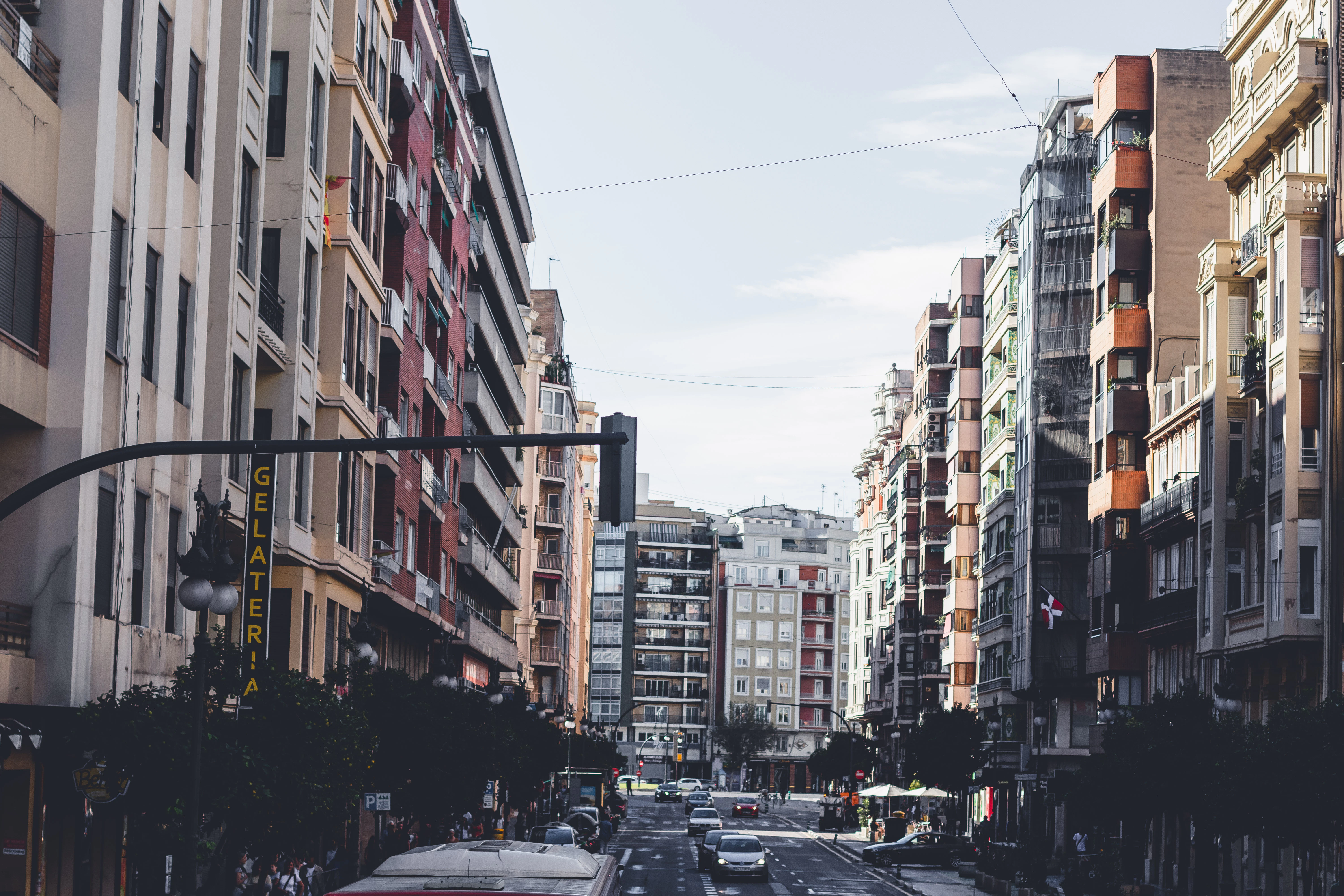 A city street filled with lots of tall buildings