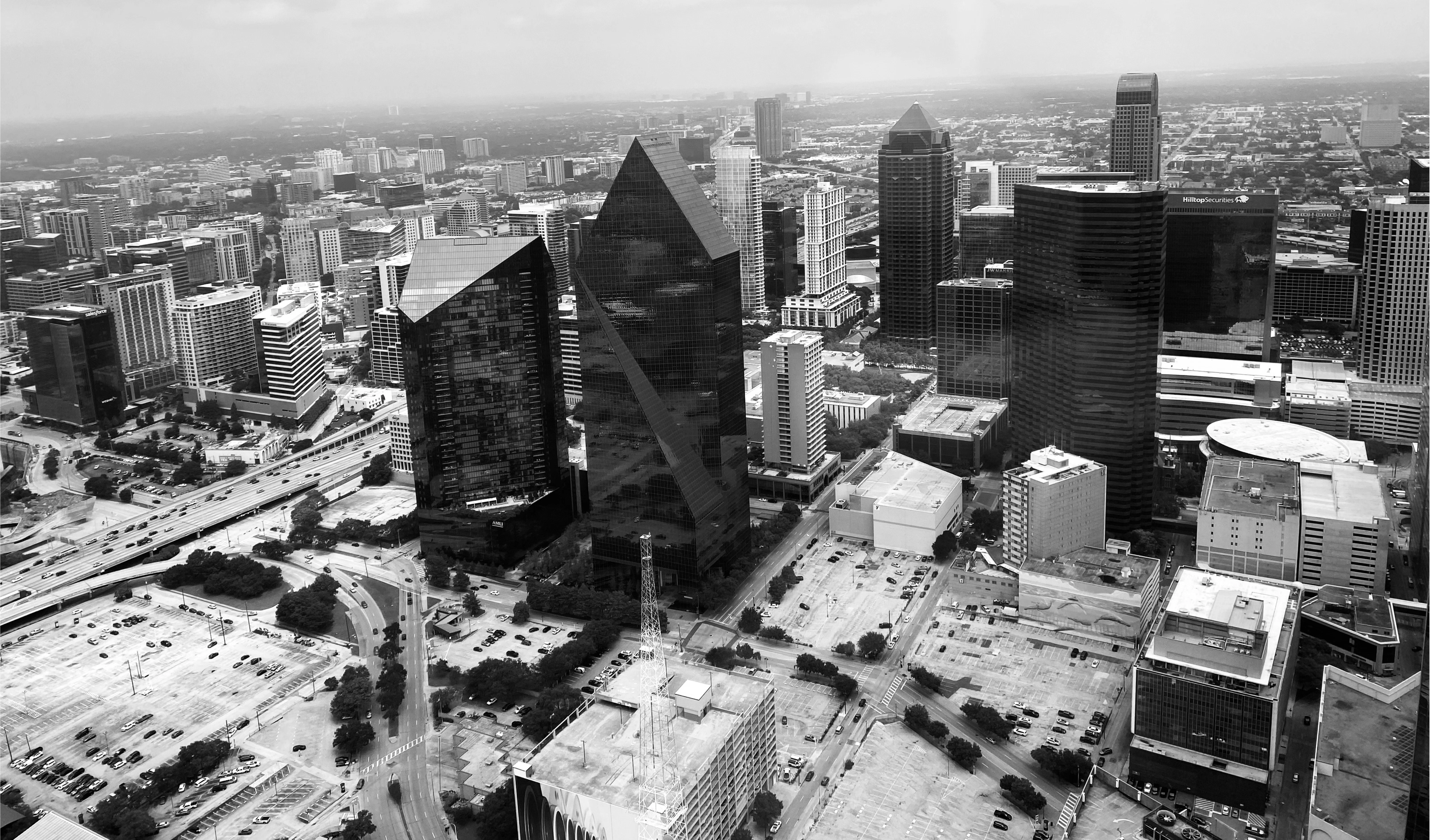 Aerial view of a modern cityscape with tall buildings.