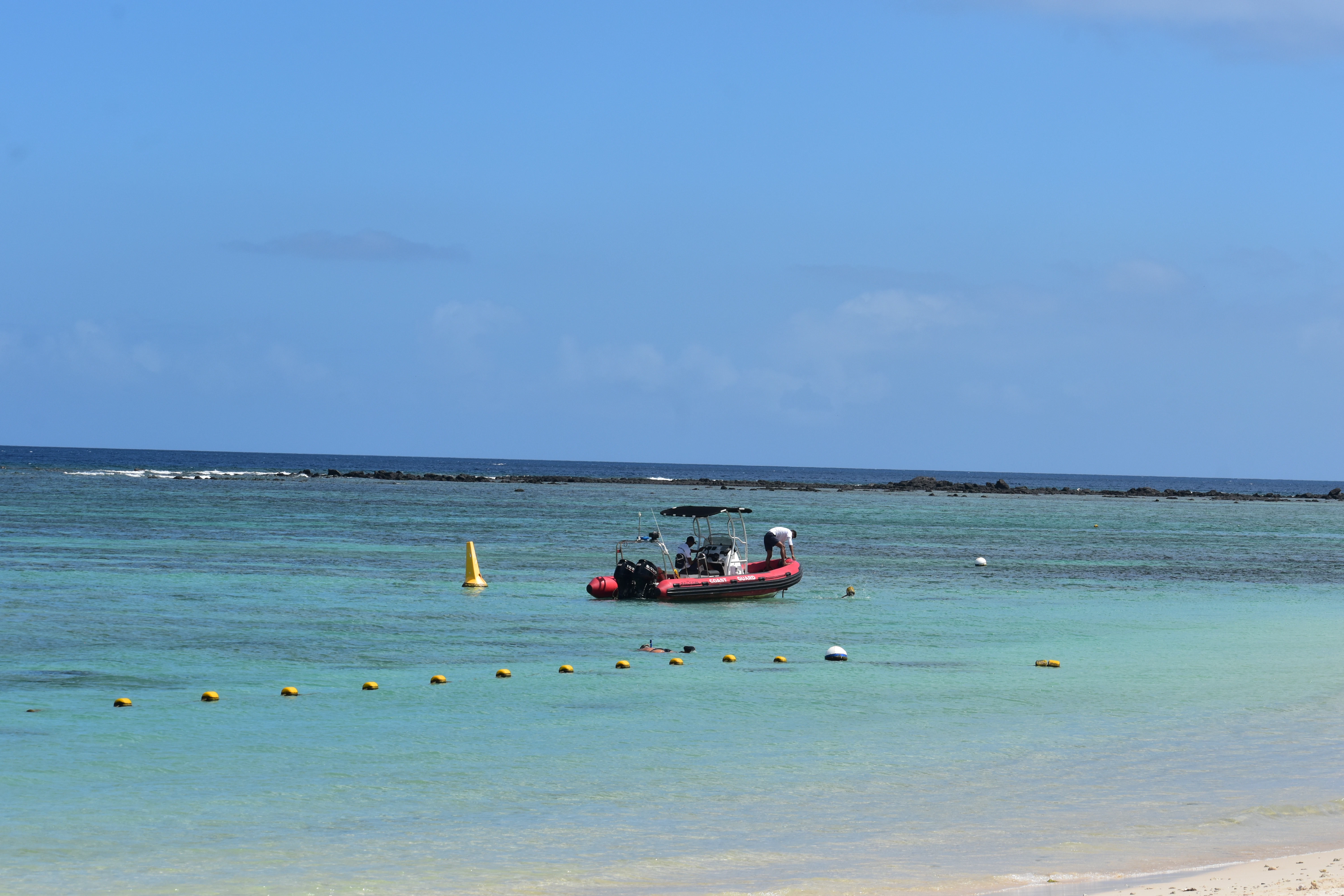 A boat floating on top of a body of water