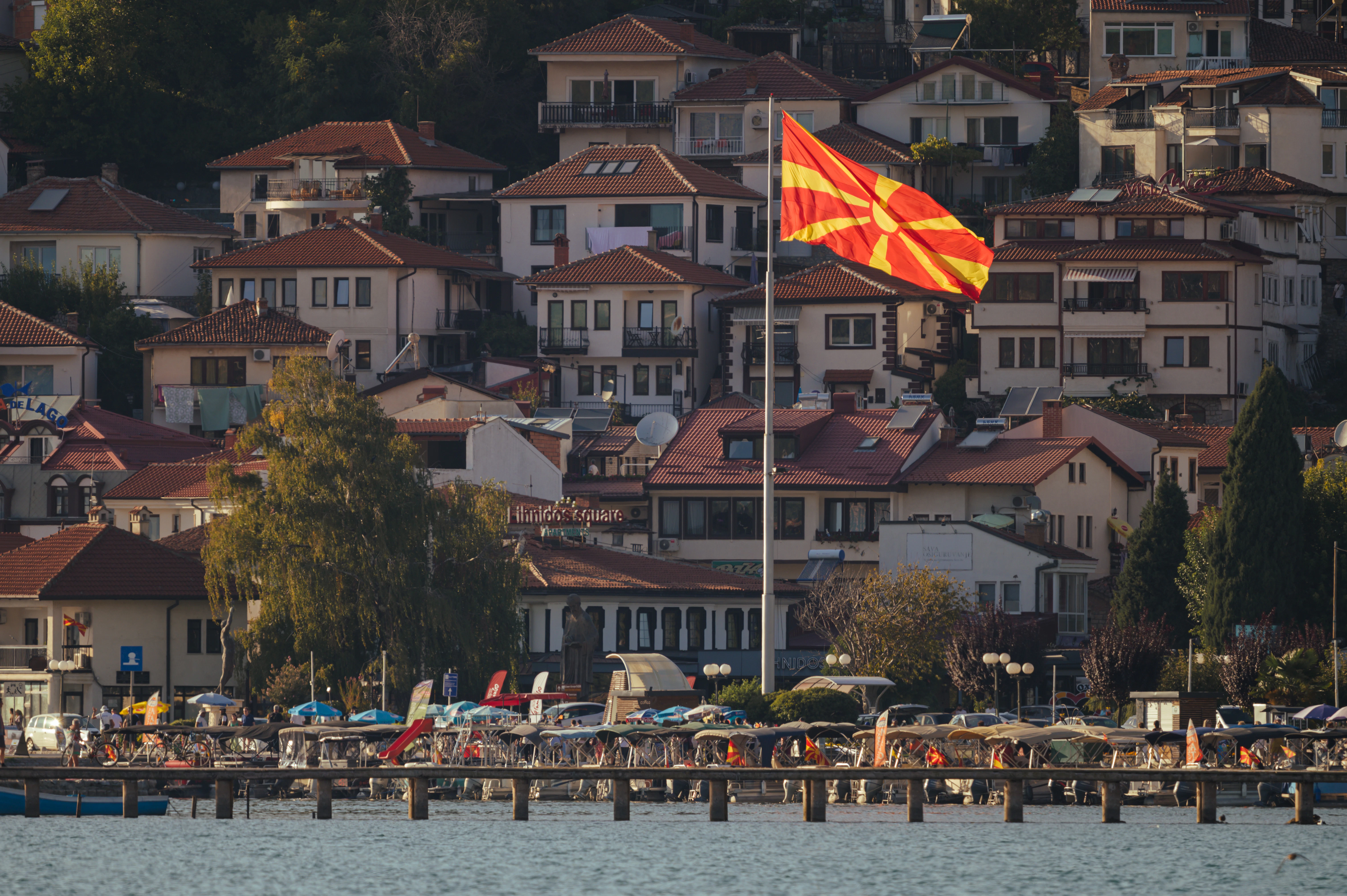 Macedonian flag waves over a lakeside town.