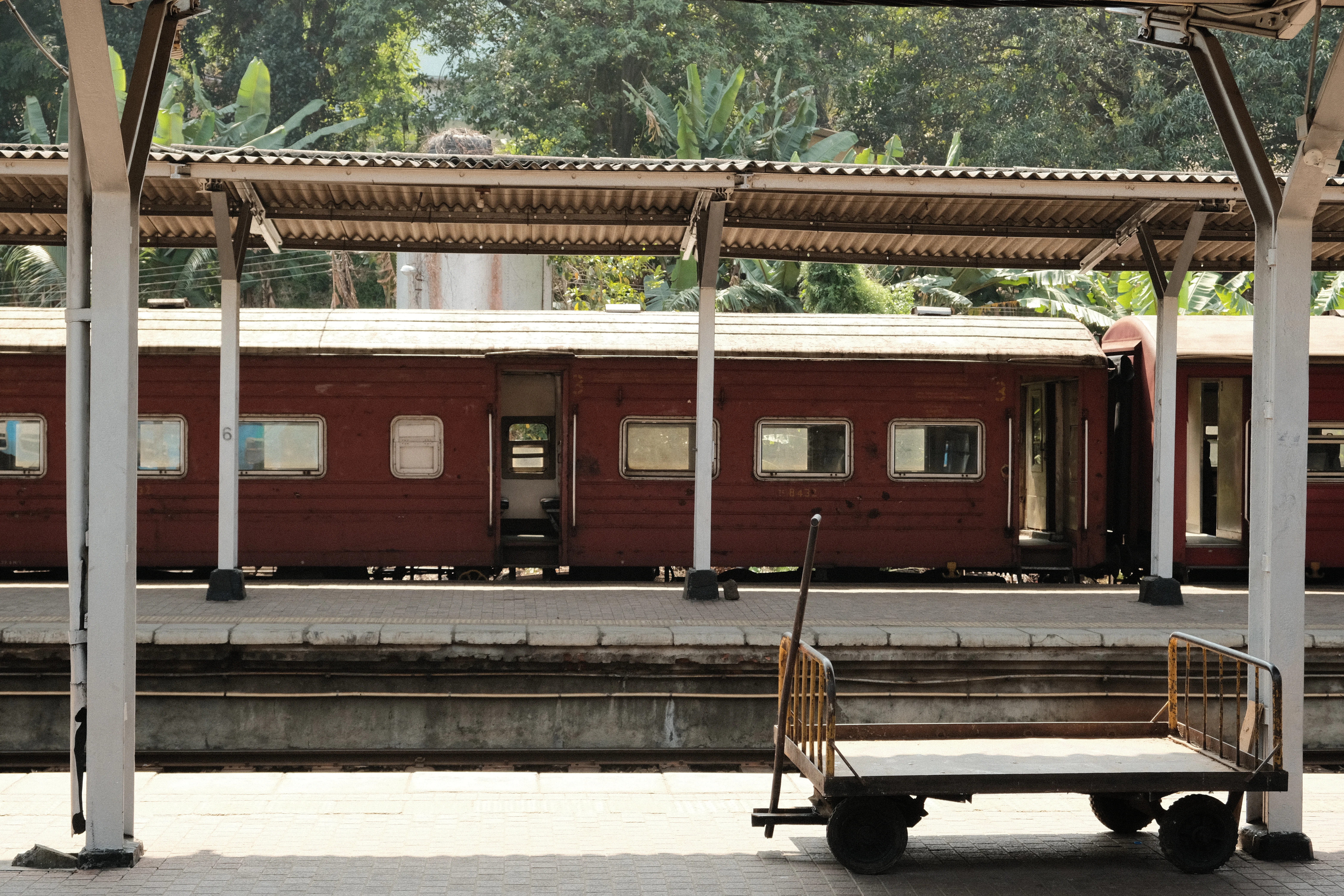 a train station with a train parked next to it