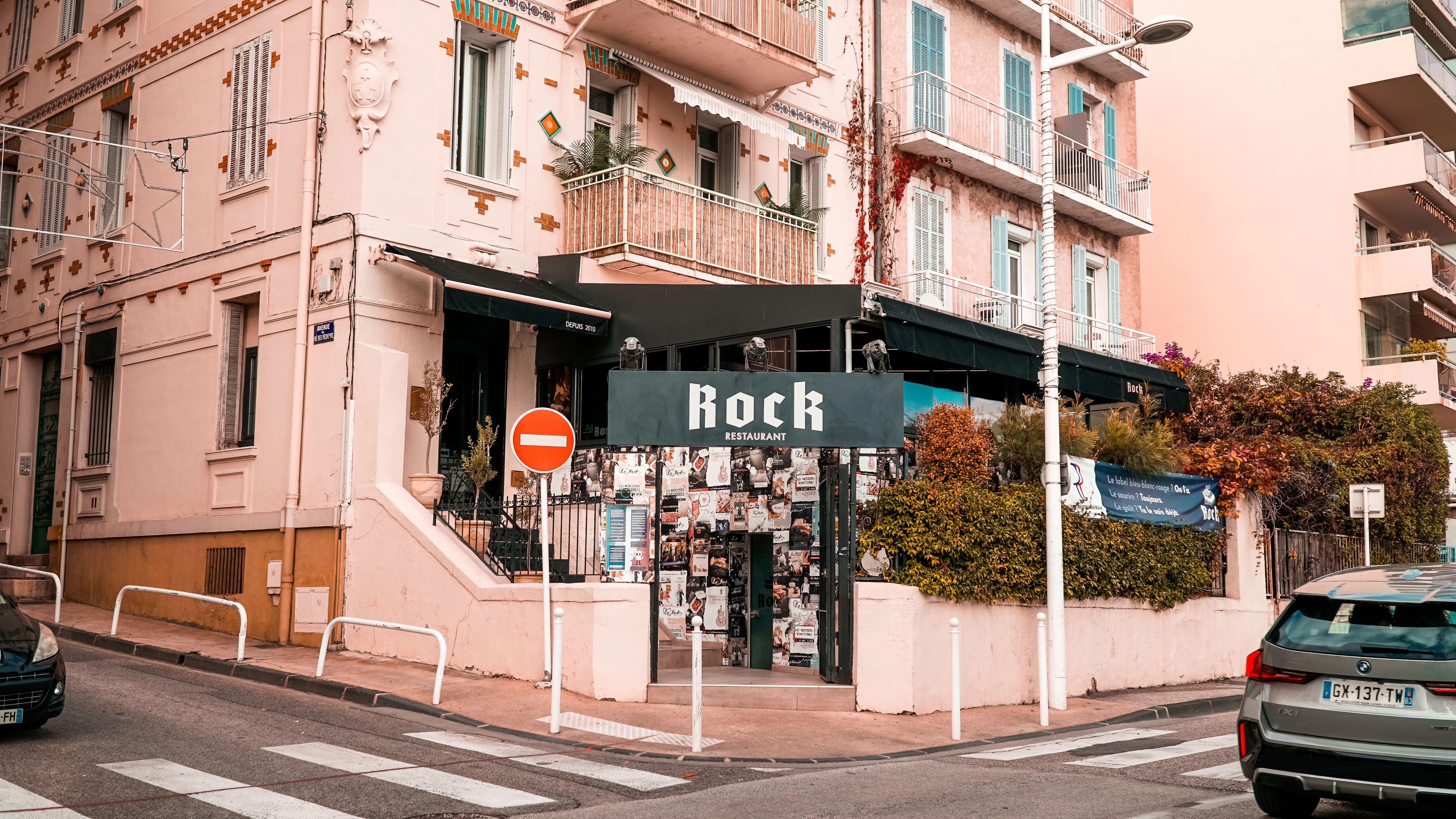 Street view of a building with "rock" sign